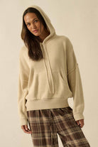 White long-sleeve ruched fitted top on model