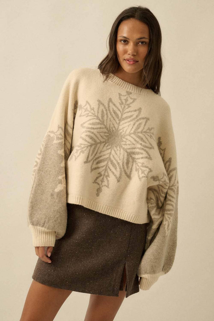 Oversized cream sweater with grey snowflake design.