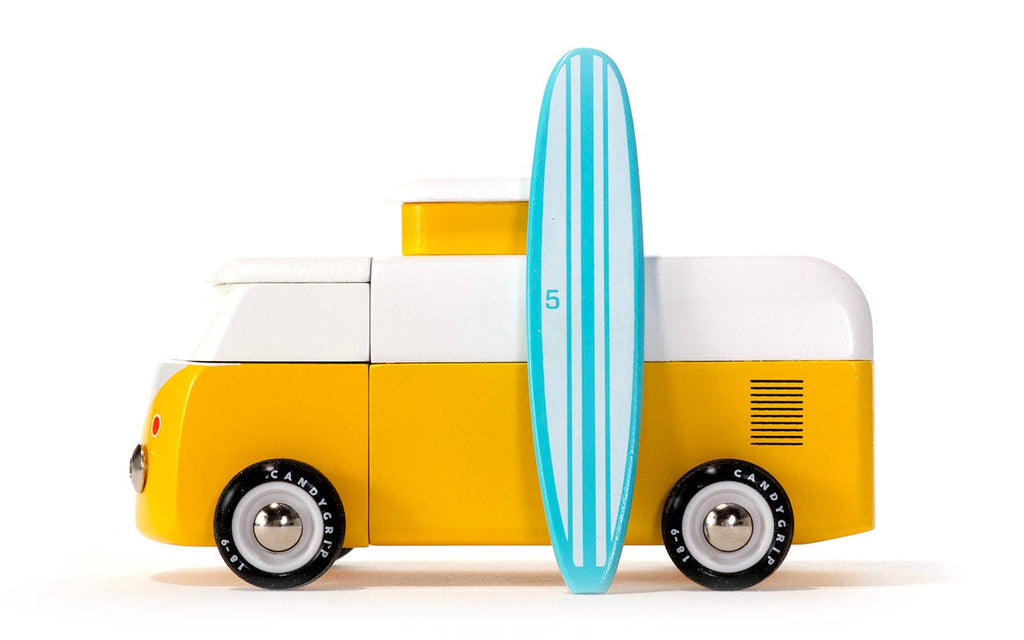 Toy van with a surfboard on a white background