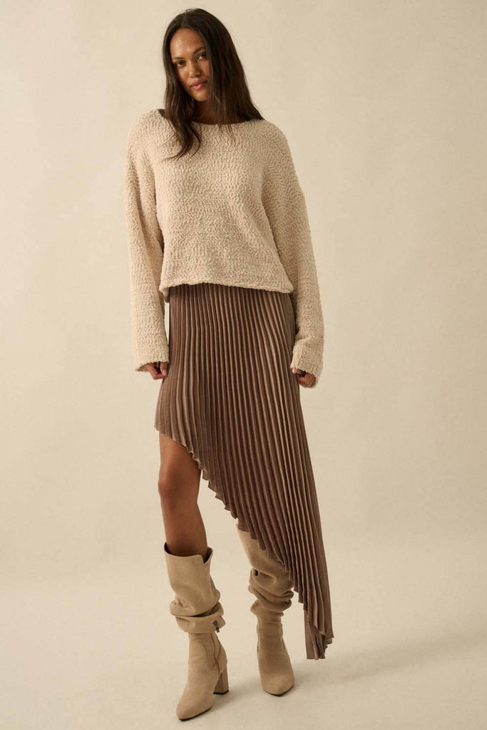 Brown asymmetric pleated skirt with flowing high-low hem.