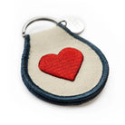 Peanuts Classic Heart Patch Keychain - A whimsical keychain featuring beloved characters in a heart design.