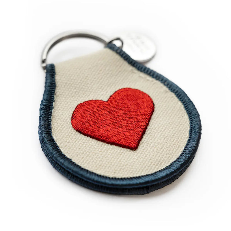 Peanuts Classic Heart Patch Keychain - A whimsical keychain featuring beloved characters in a heart design.