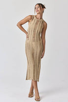 Woman wearing a sleeveless ladder knit midi dress.