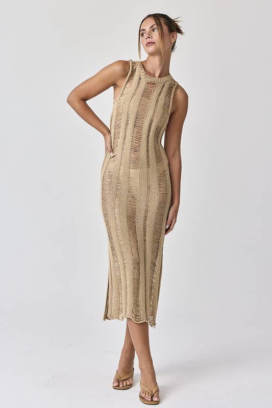 Woman wearing a sleeveless ladder knit midi dress.