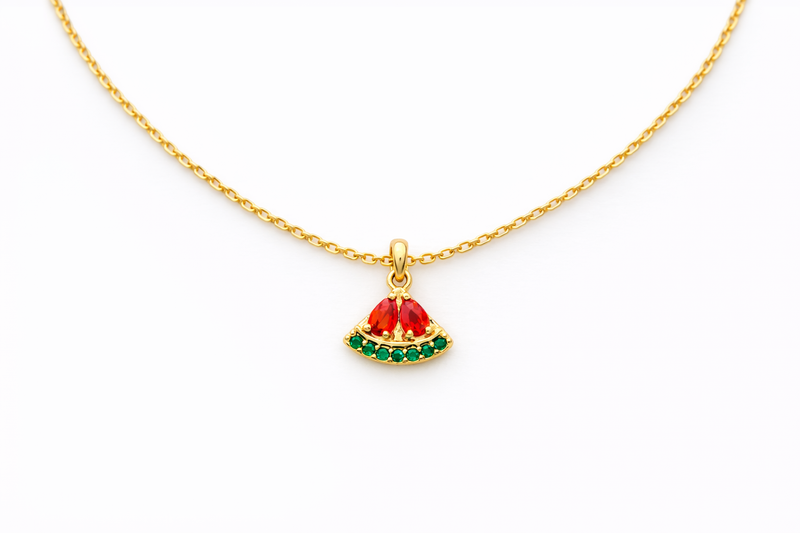 Gold necklace with a watermelon pendant on a white background