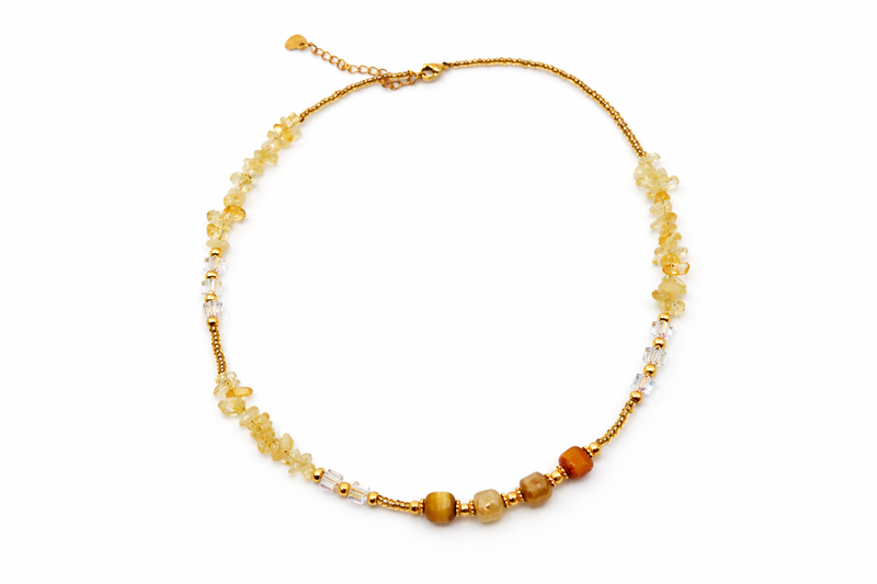 Necklace with yellow beads on a white background
