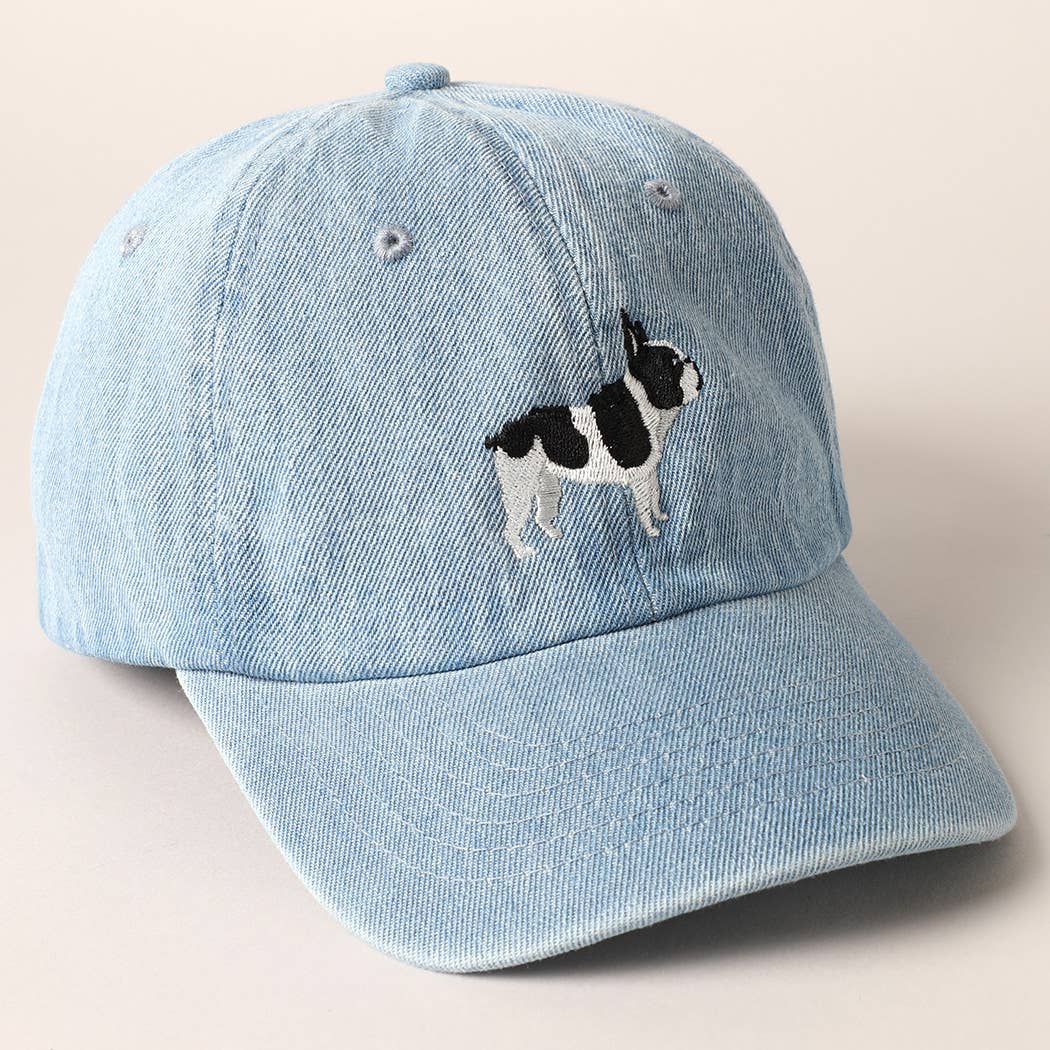 Light-wash denim baseball cap with embroidered black and white French Bulldog design.