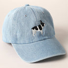 Light-wash denim baseball cap with embroidered black and white French Bulldog design.