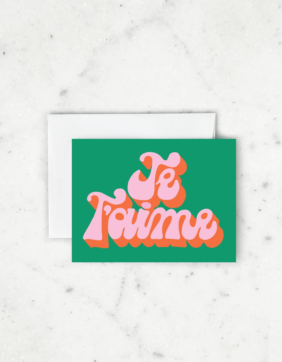 Green card with pink text 'Je T'aime' on a white background