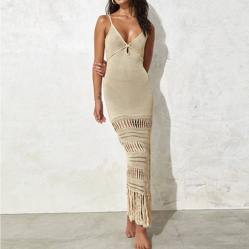 Woman wearing a Seaside Serenity Crochet Cover-Up Dress with a crochet design, adjustable spaghetti straps, and a fringe hem.