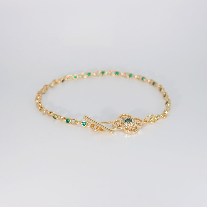  Lotus Bracelet: Shimmering stones encircling a serene green centerpiece, epitome of elegance and tranquility.