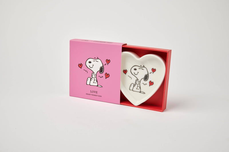 Heart-shaped ceramic trinket dish with a black-and-white illustration of a smiling beagle, accented by red hearts, alongside a matching pink gift box.