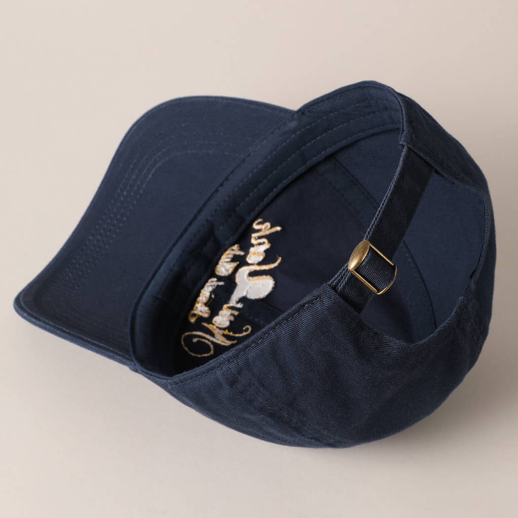 Beige and navy New York Social Club embroidered baseball caps with curved brims.