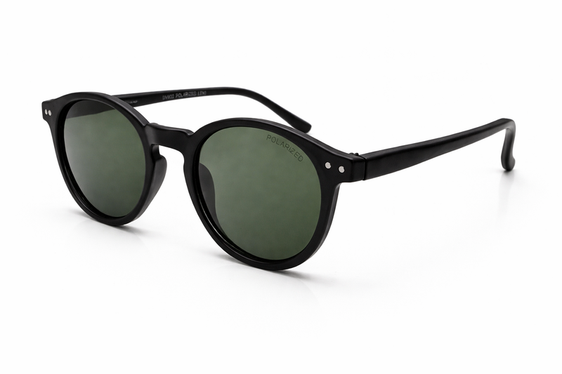 Black sunglasses with green lenses on a white background