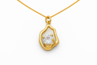 Gold pendant with a diamond on a white background