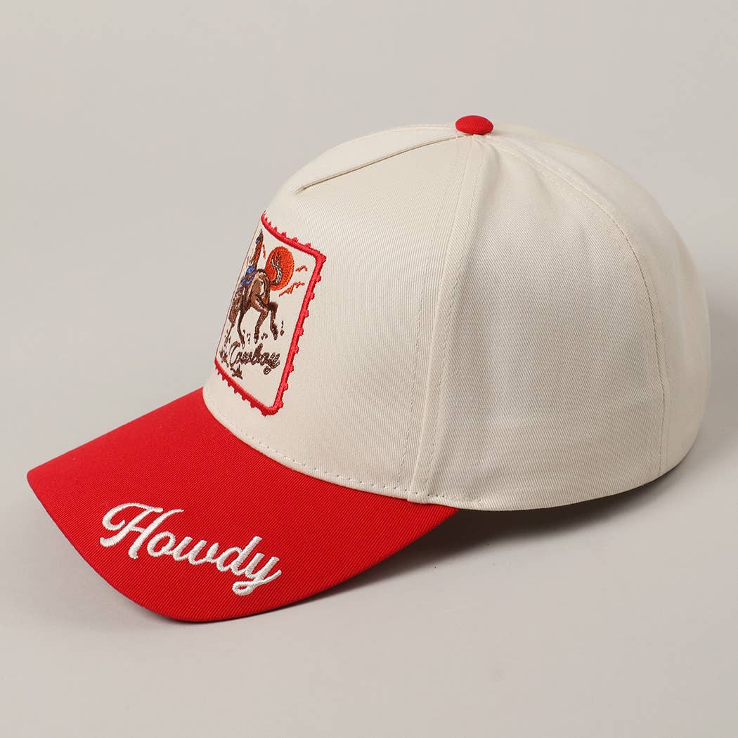 Cap with red brim and white front, featuring an embroidered design and 'Howdy' text on a gray background