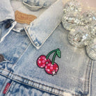Disco Ball Cherries Patch featuring a pair of cherries designed as shiny disco balls.