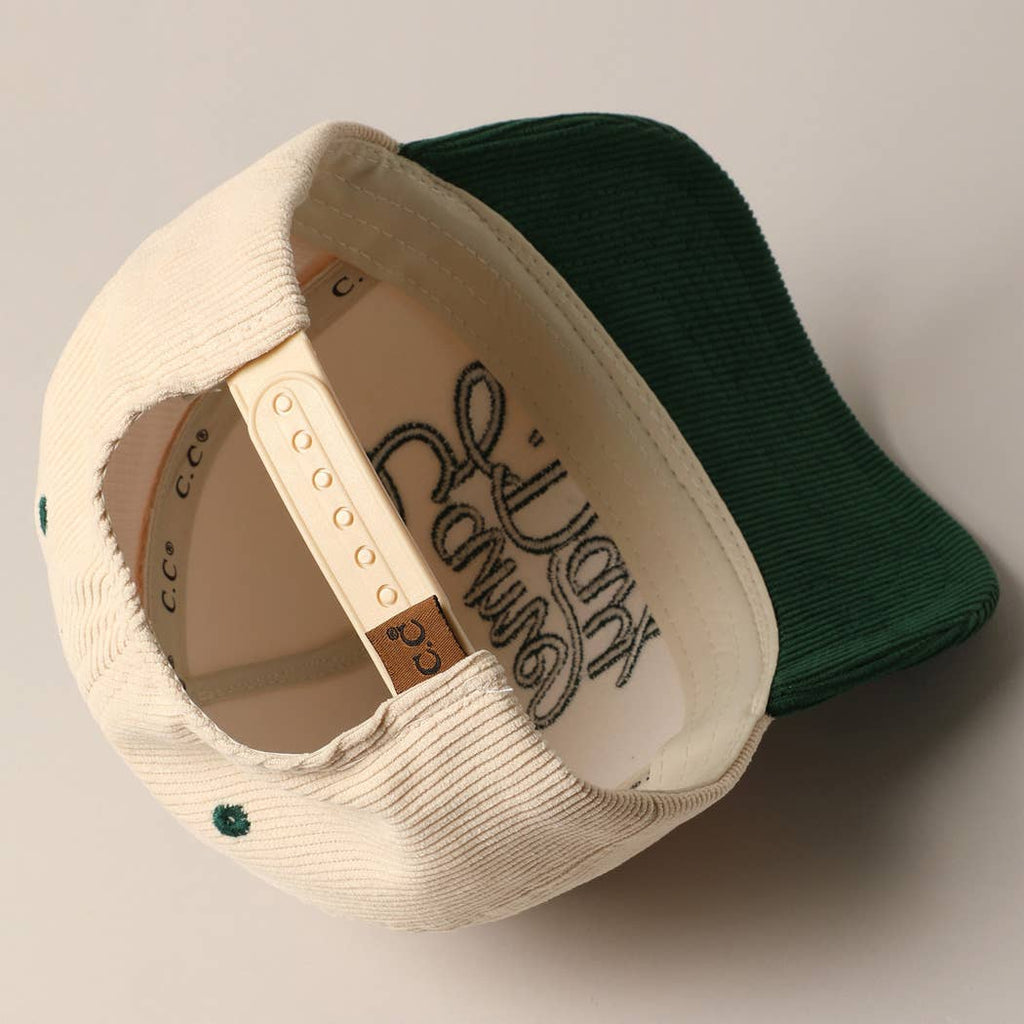 Corduroy trucker baseball cap with "Game Day" embroidered in navy on cream and navy fabric.