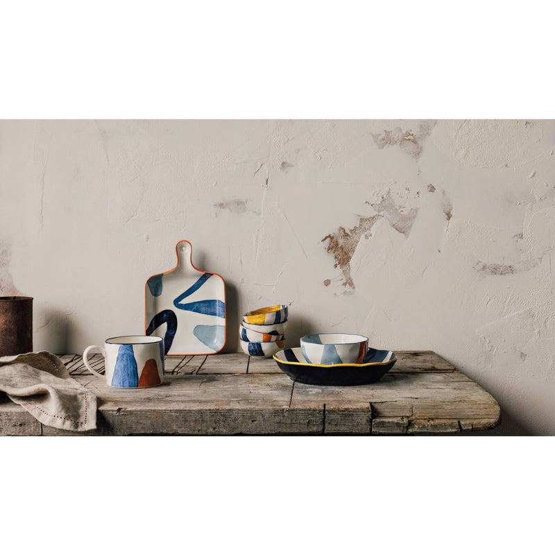 Canvas Mug with abstract mustard yellow, navy blue, and light blue patterns.