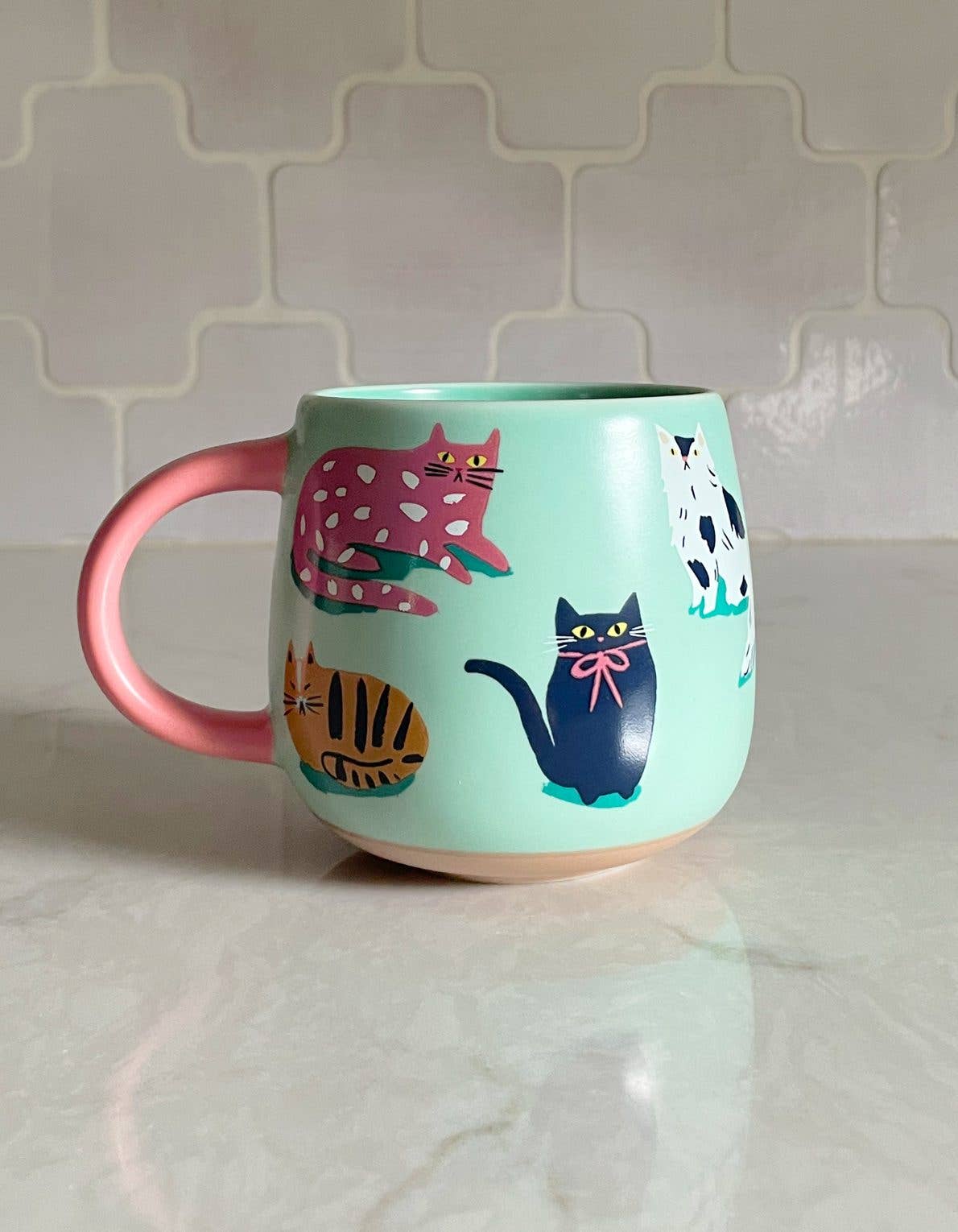 FORMA Ceramic Cats Mug - Whimsical cat illustrations for charming coffee moments.