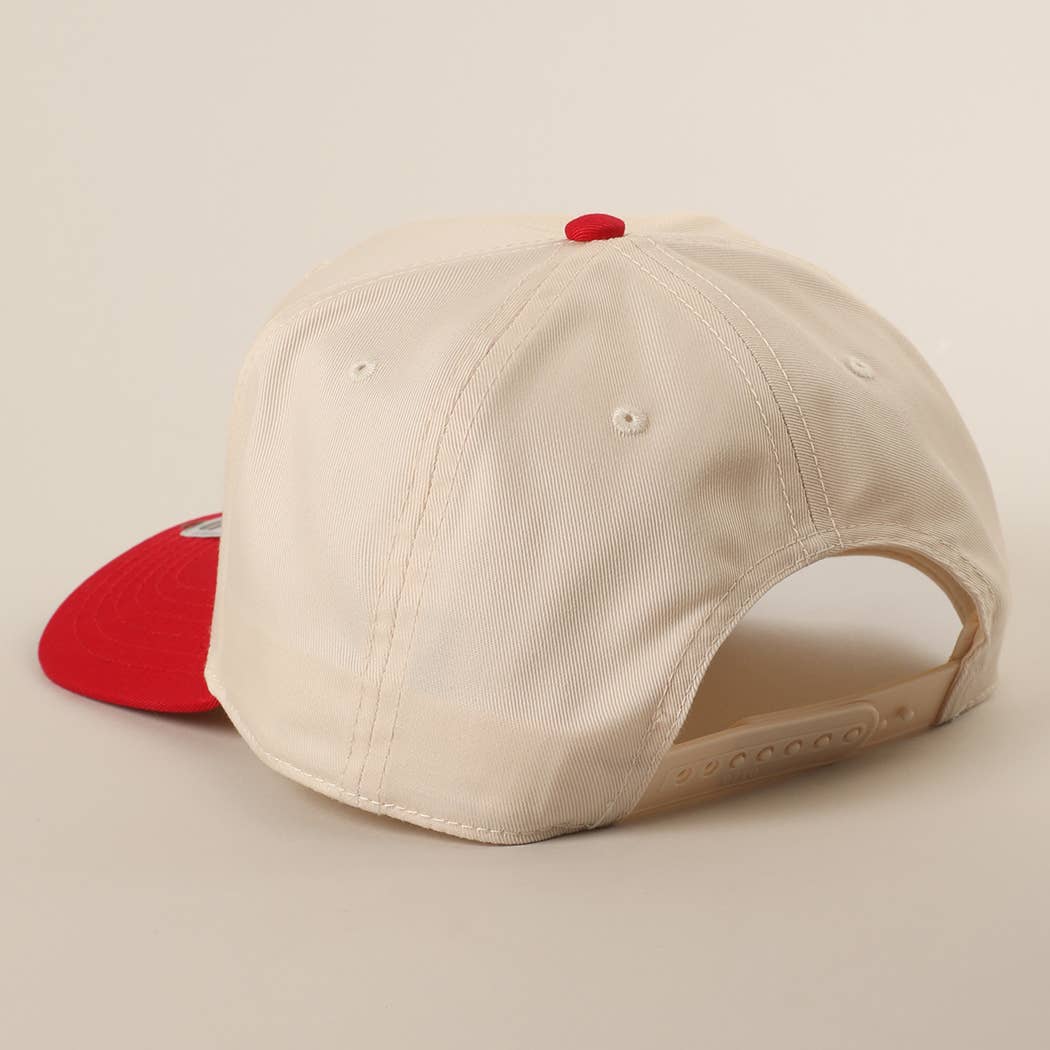 Beige baseball cap with red brim on a beige background