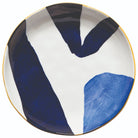Canvas Stamped Plate with abstract mustard yellow, navy blue, and light blue patterns.