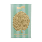 "Leaf Me Alone" brass metal bookmark in the shape of a leaf with bold text.
