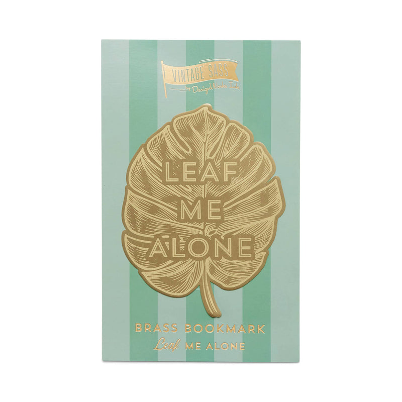 "Leaf Me Alone" brass metal bookmark in the shape of a leaf with bold text.