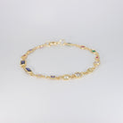 Blossom Bracelet: Gold chain bracelet with colorful gemstones cascading down.