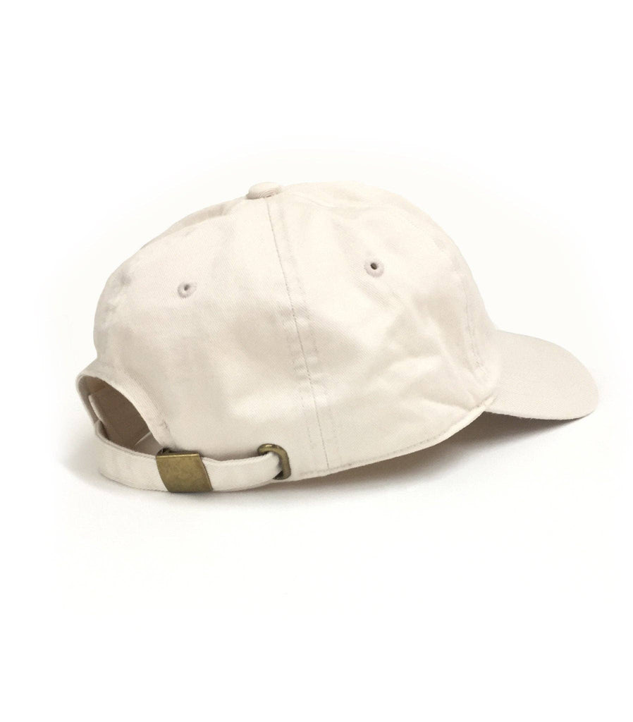 Beige baseball cap with embroidered whiskey glass and cigar design on the front.