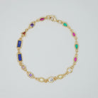 Blossom Bracelet: Gold chain bracelet with colorful gemstones cascading down.