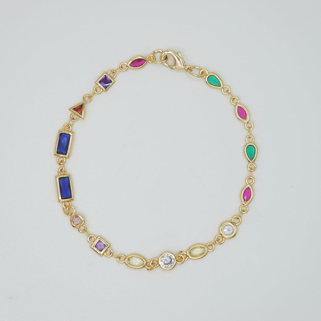 Blossom Bracelet: Gold chain bracelet with colorful gemstones cascading down.