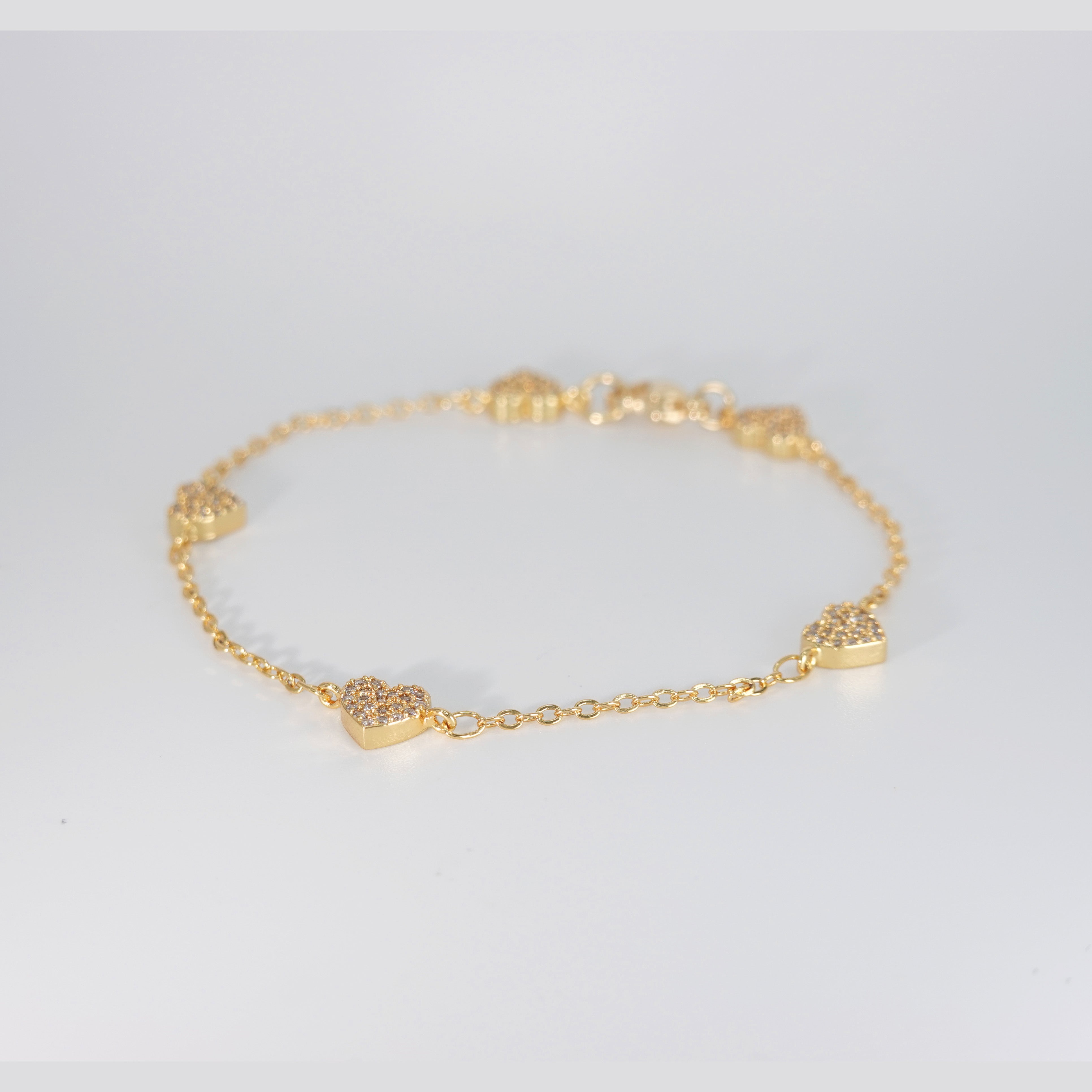 Rosebud Bracelet: Delicate heart-shaped motifs adorned with shimmering stones, epitome of romantic allure.