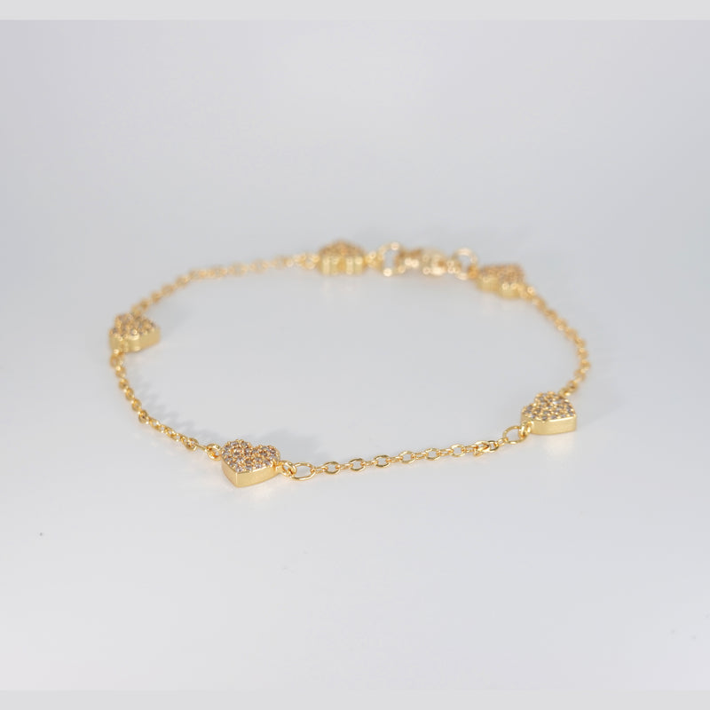 Rosebud Bracelet: Delicate heart-shaped motifs adorned with shimmering stones, epitome of romantic allure.