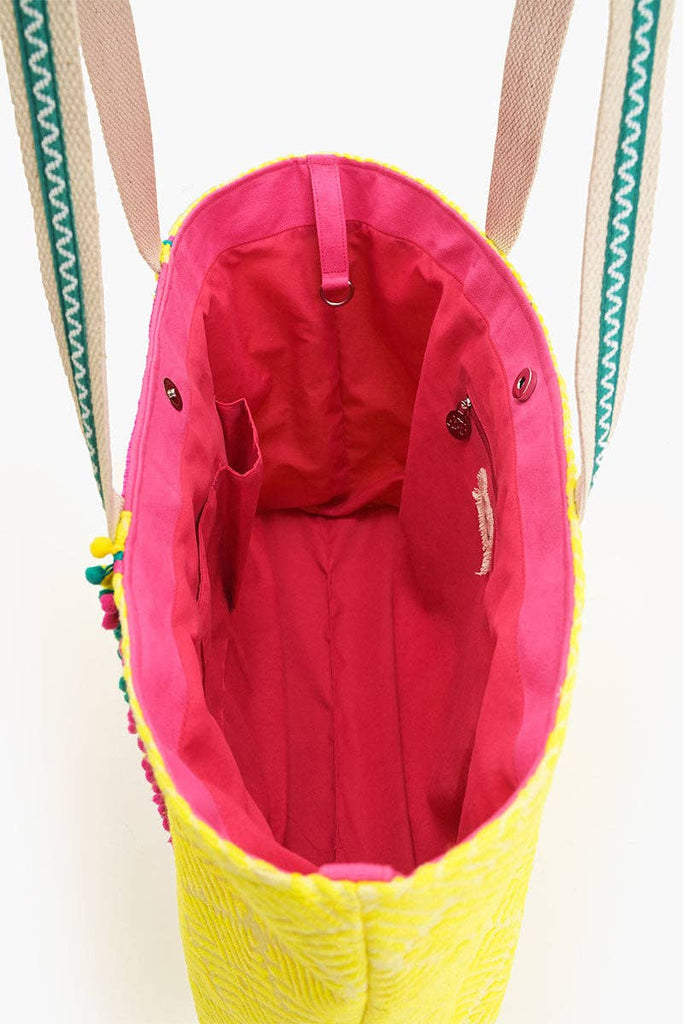 Colorful beaded tote bag with "Amalfi La Dolce Vita" text, lemon motif, and yellow-pink fabric with green handles.