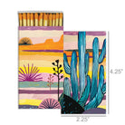 Matchbox with a colorful desert landscape illustration, featuring cacti and sunset-inspired tones.