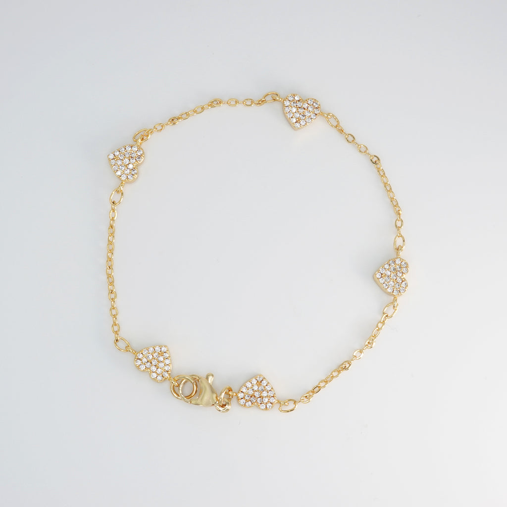 Rosebud Bracelet: Delicate heart-shaped motifs adorned with shimmering stones, epitome of romantic allure.