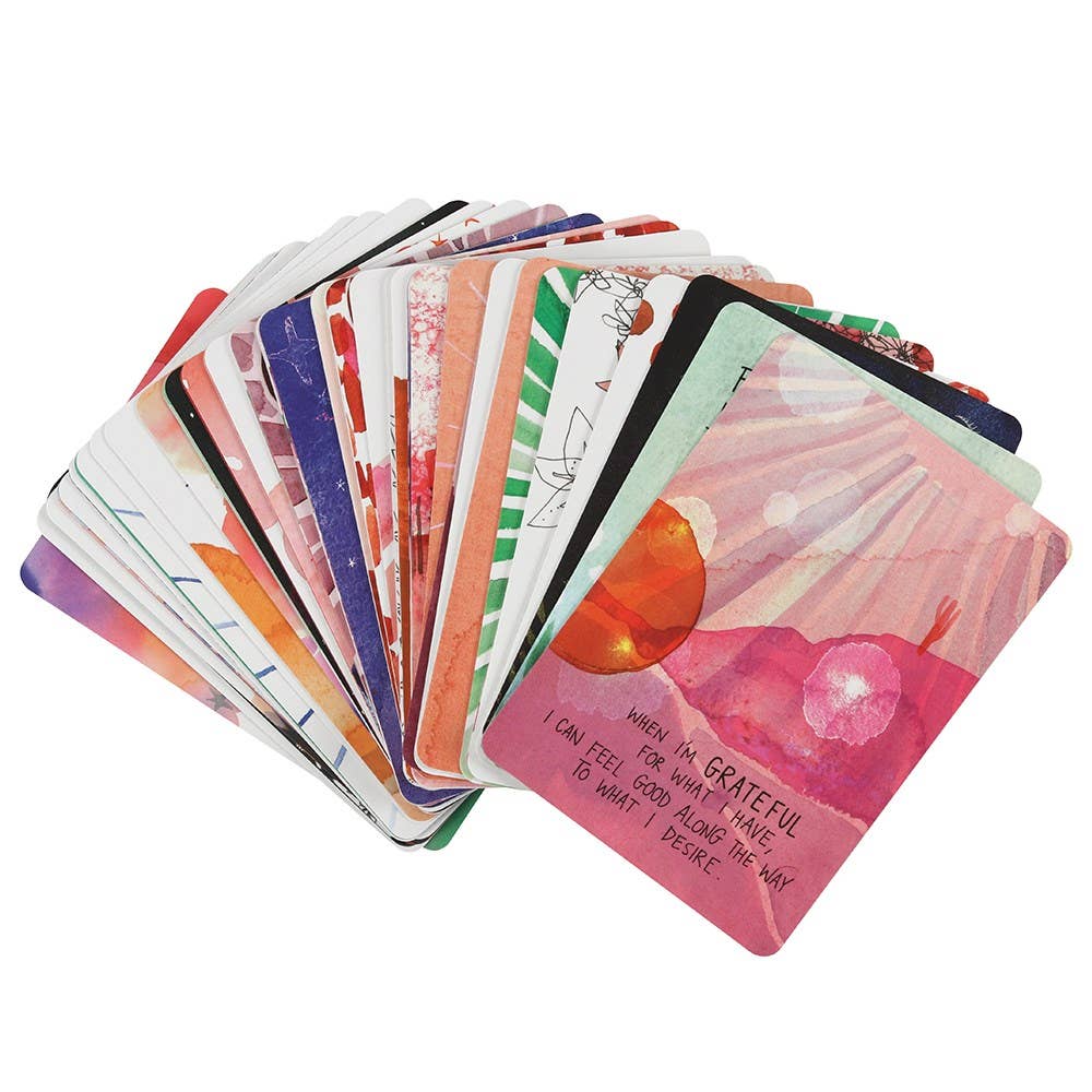 Super Attractor Oracle Card Deck by Gabrielle Bernstein featuring a purple box with stars and moon artwork.