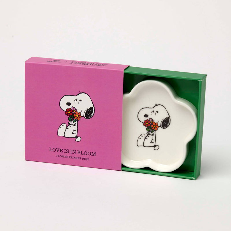 Flower-shaped ceramic trinket dish featuring a black-and-white beagle holding a bouquet of red and orange flowers, packaged in a pink and green gift box.