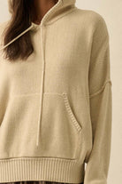 White long-sleeve ruched fitted top on model