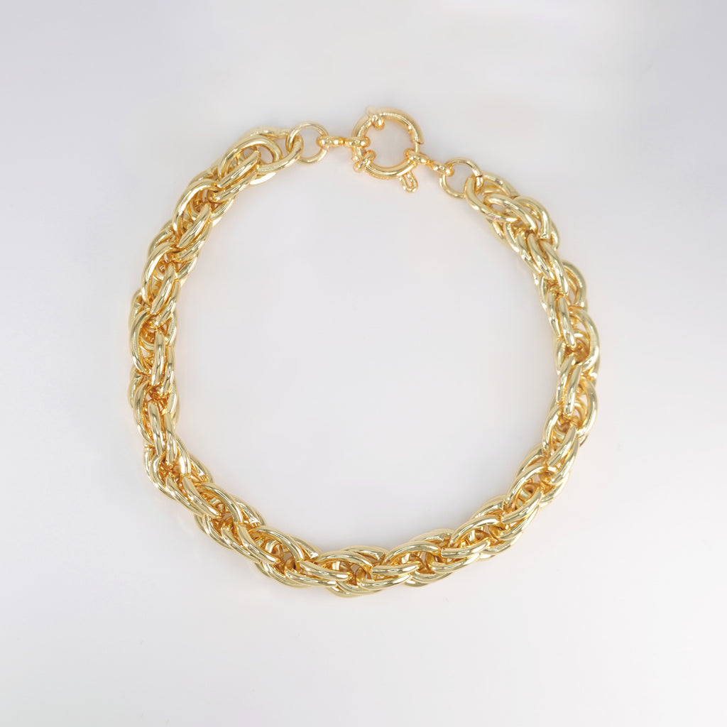 Lily Bracelet: Delicate gold chain bracelet with colorful gemstones.