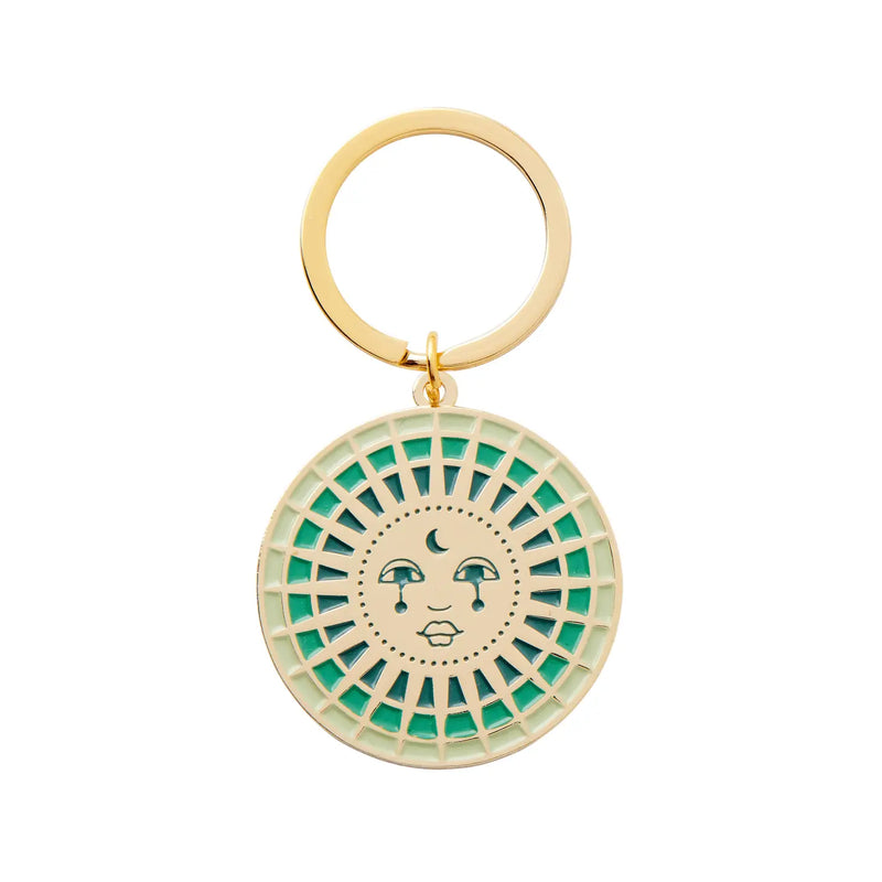 Moon Enamel Keychain featuring a crescent moon design with intricate enamel detailing and a durable metal ring for keys.