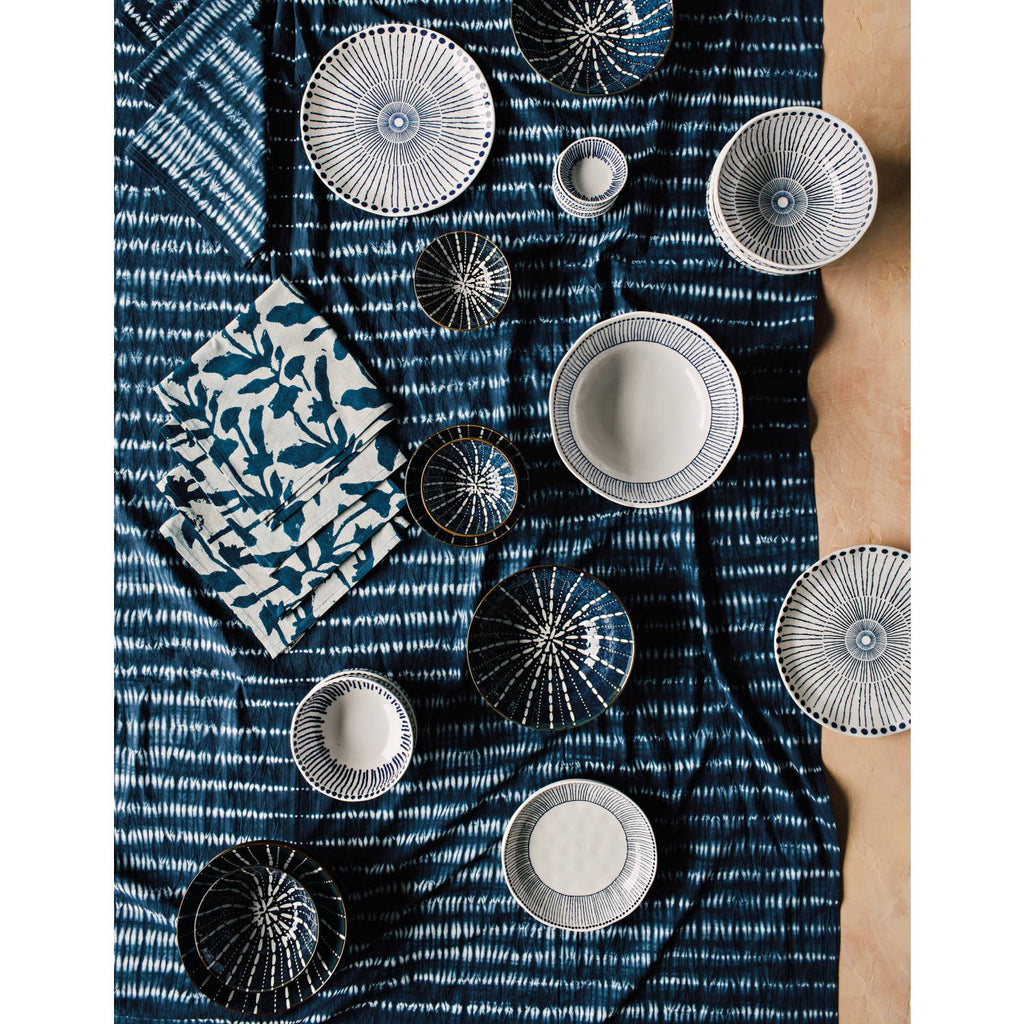 Sprout Stamped Plate with intricate blue radial patterns and an organic shape, ideal for serving and display.