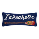 Lakeaholic hook pillow with a deep blue background, white "Lakeaholic" script, and a colorful paddle graphic.