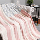 Multicolored striped blanket draped over a chair in a living room setting.