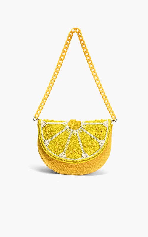 Yellow lemon slice-shaped bag with beaded detailing and a matching twisted rope shoulder strap.