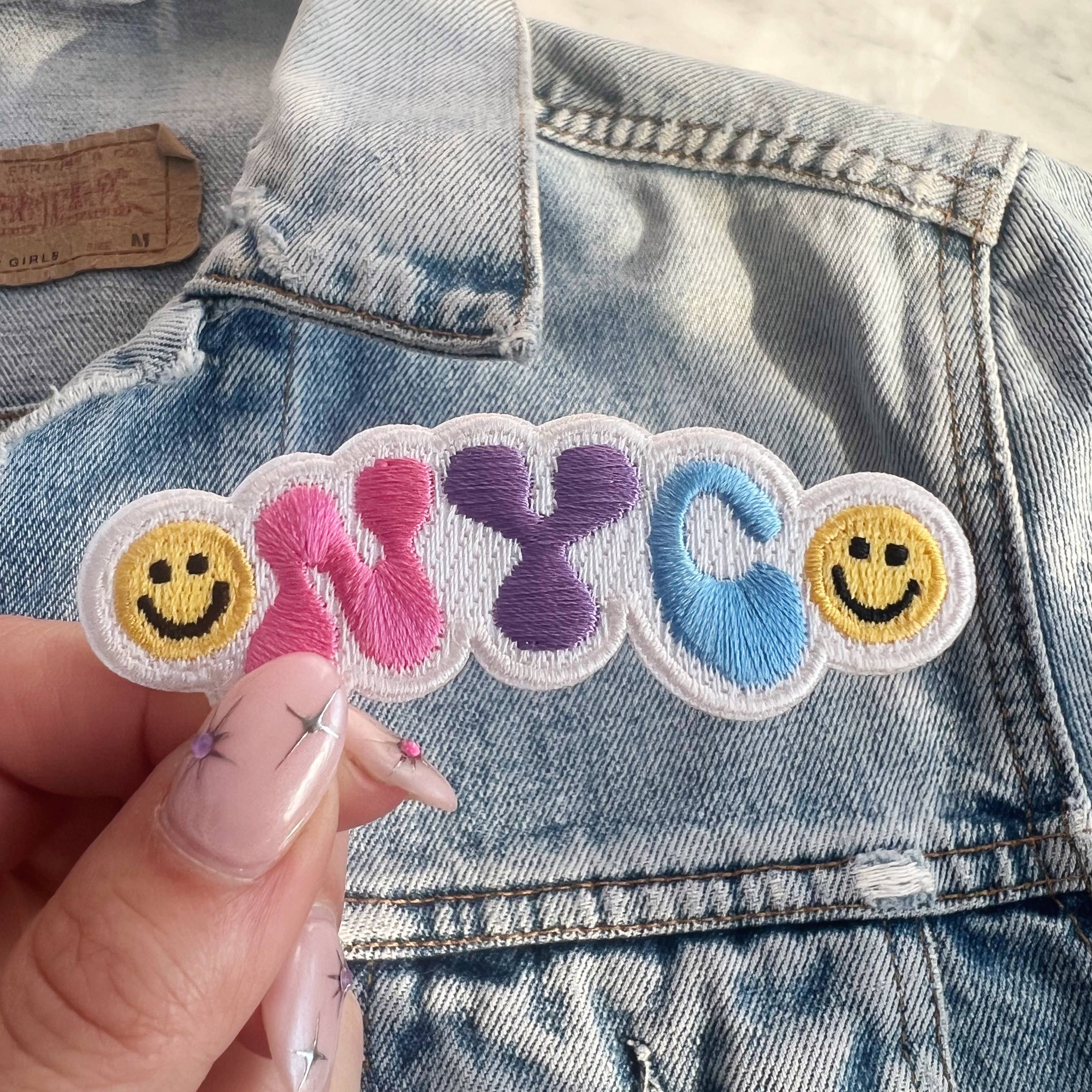 NYC Smiley Patch featuring a cheerful smiley face with the NYC skyline.