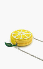 Round beaded lemon slice crossbody bag with silver chain strap and green leaf charm accent.