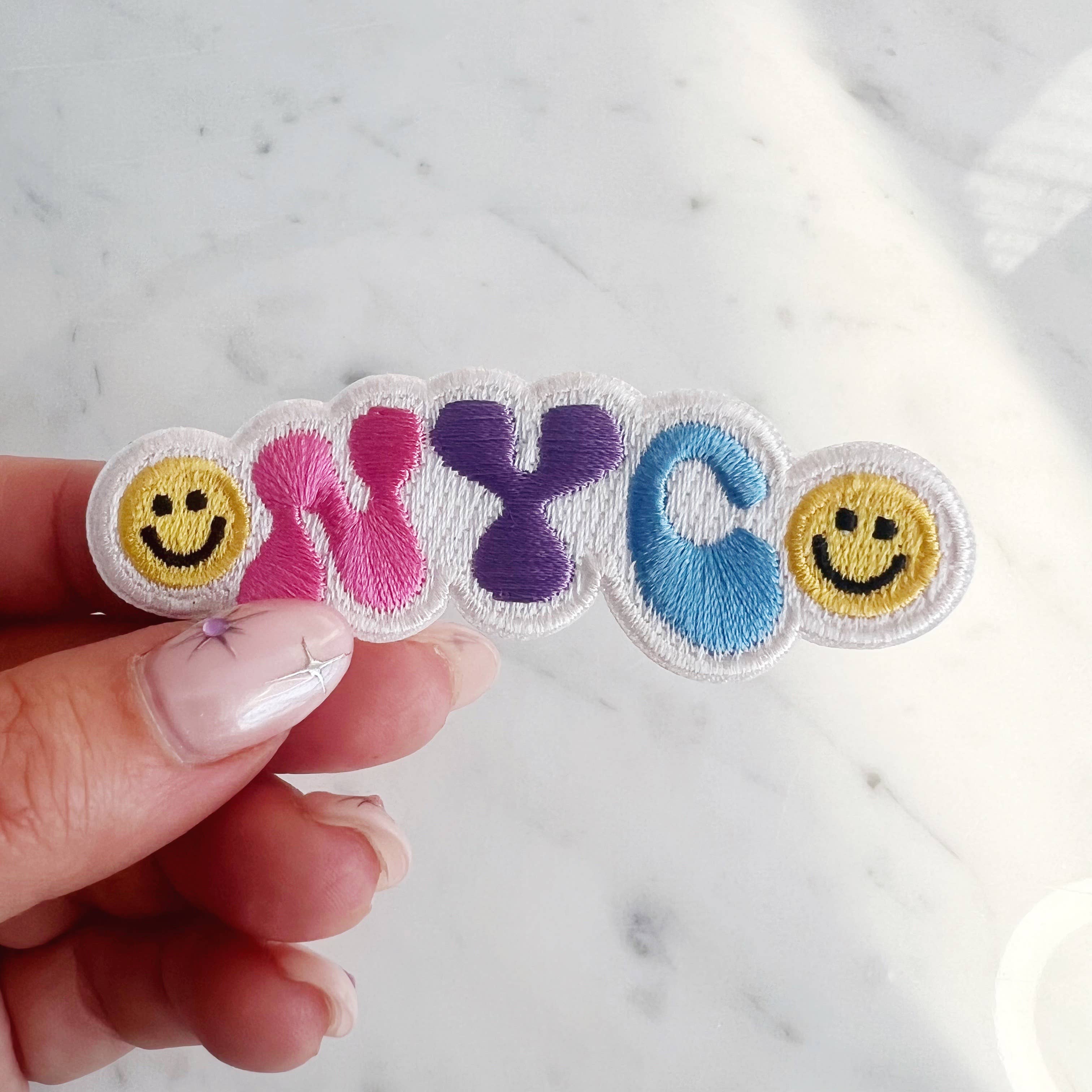 NYC Smiley Patch featuring a cheerful smiley face with the NYC skyline.