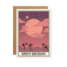 Happy Birthday card featuring a dreamy desert scene with a Joshua tree and a large moon against a starry purple and pink sky.